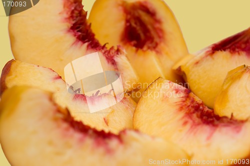 Image of Slices of peach isolated, focus on center