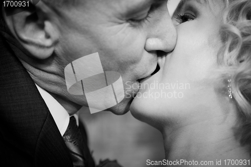 Image of Happy bride and groom kissing
