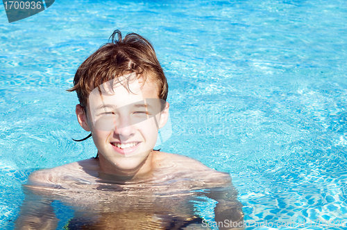 Image of Happy boy in a pool