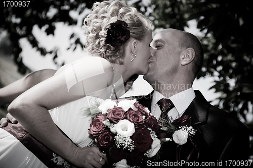 Image of Happy bride and groom kissing