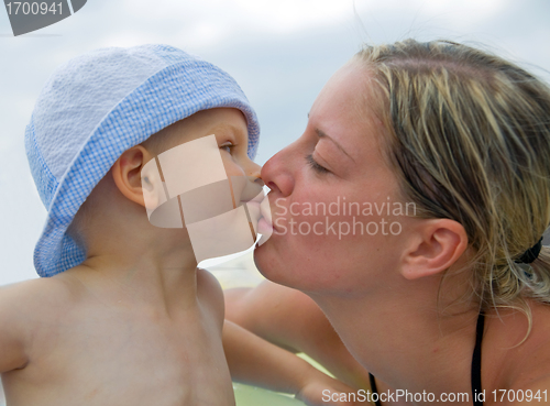 Image of Mother kissing her child