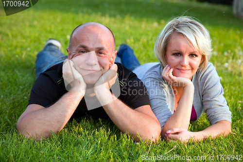 Image of Adult happy couple together on grass