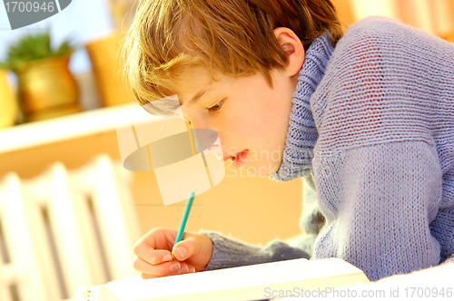 Image of Boy doing homework