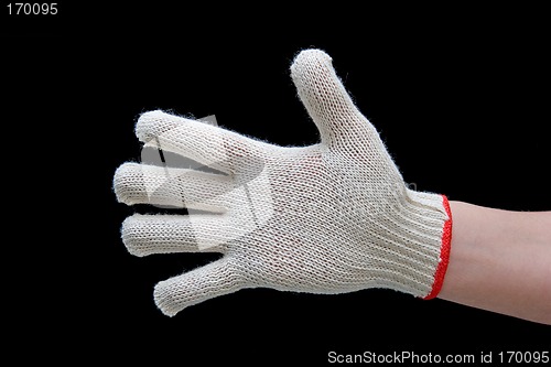 Image of Hand in safety glove isolated on black