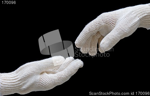 Image of Labor's hands in safety gloves conection. isolated on black