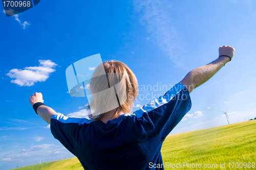 Image of Happy man with arms up