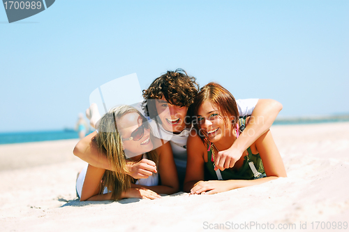 Image of Young friends on the summer beach