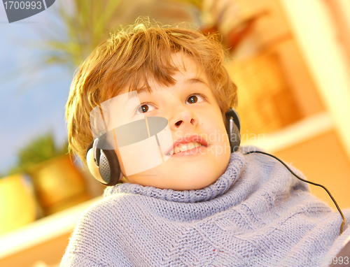 Image of Boy listen to music