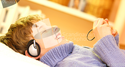 Image of Boy listen to music
