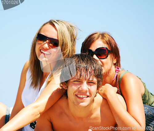 Image of Young friends on the summer beach