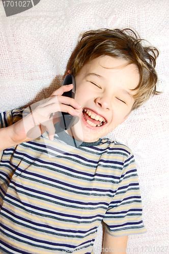 Image of Teen boy talking on cell phone