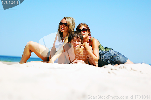 Image of Young friends on the summer beach