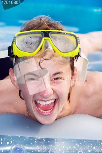 Image of Playful boy in a pool