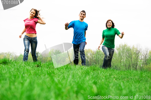 Image of Happy friends jumping