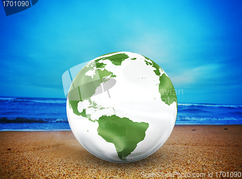Image of Planet earth model on the beach