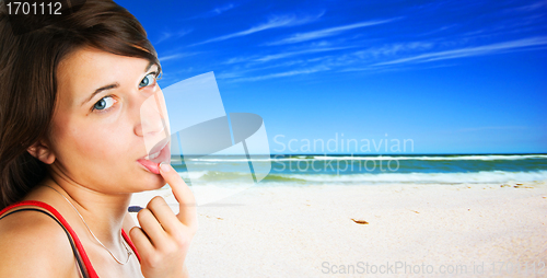 Image of Young woman on tropical beach