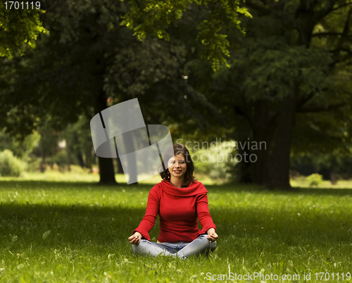 Image of Young woman doing yoga