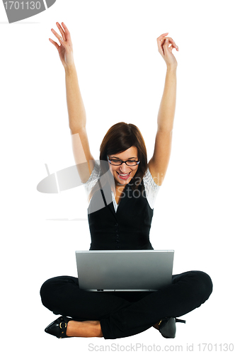 Image of Happy businesswoman with laptop