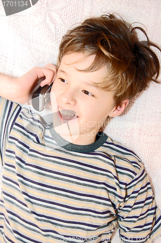 Image of Teen boy talking on cell phone