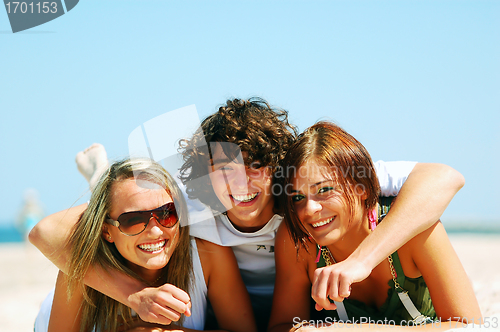 Image of Young friends on the summer beach