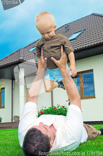 Image of Father having fun with a son