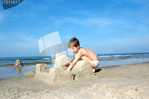 Image of Boy playing on the beach