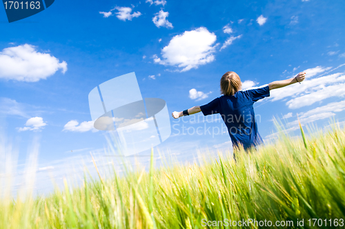 Image of Happy man with arms up