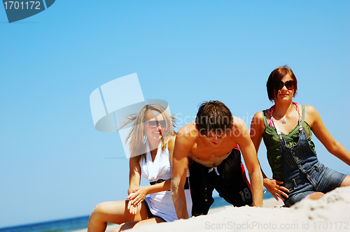 Image of Young friends on the summer beach