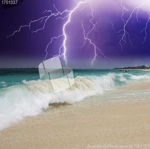 Image of Wave on the Beach with Storm in the Background