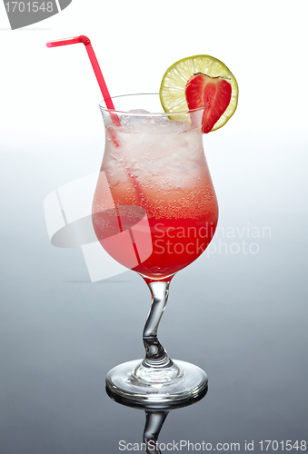 Image of glass of red cocktail with strawberry decor
