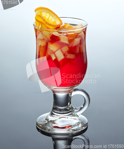 Image of glass of tea with fresh fruits and syrup