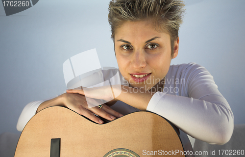 Image of woman and guitar