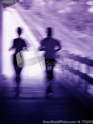 Image of Artistic blur of a running couple