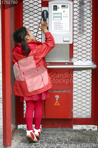 Image of red public phone