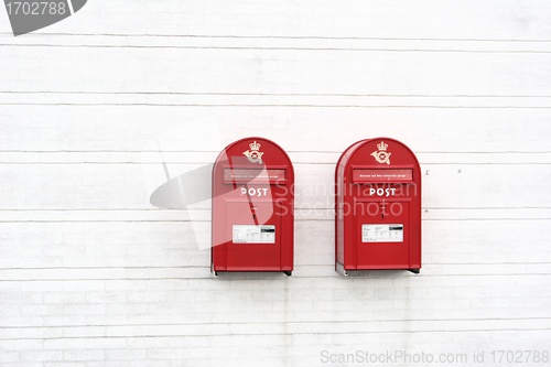 Image of red post boxes