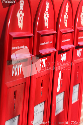 Image of red post boxes