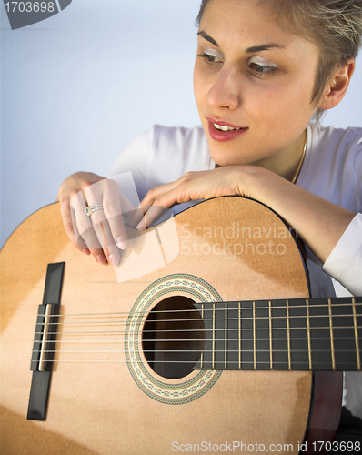 Image of woman and guitar