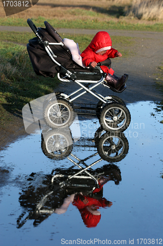 Image of child in a carriage