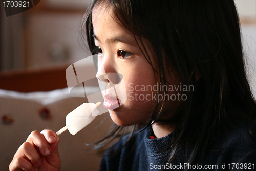 Image of child eating ice