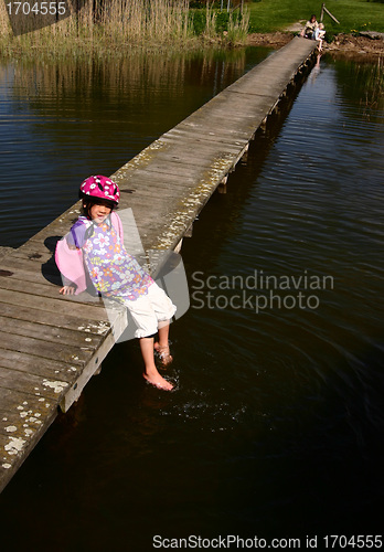 Image of Child playing at the lake