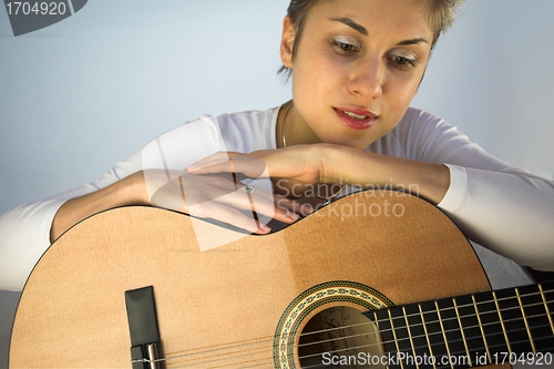 Image of woman and guitar