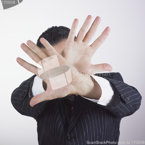 Image of Businessman hiding