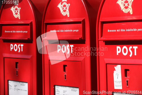 Image of red post boxes