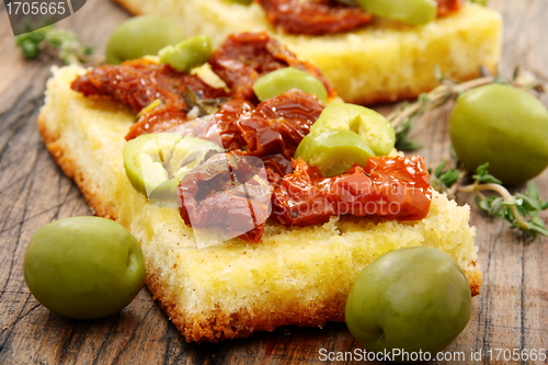 Image of Bread with olives, sun dried tomatoes and thyme.
