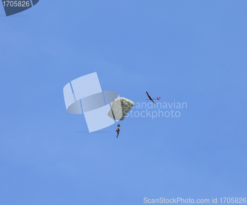 Image of RC glider flies around jumper