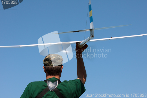 Image of Man launches into the sky RC glider