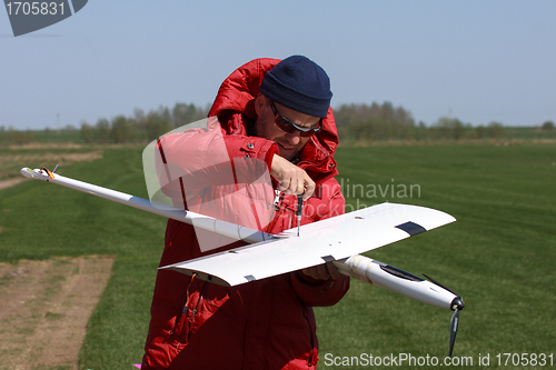 Image of Man assembly RC glider