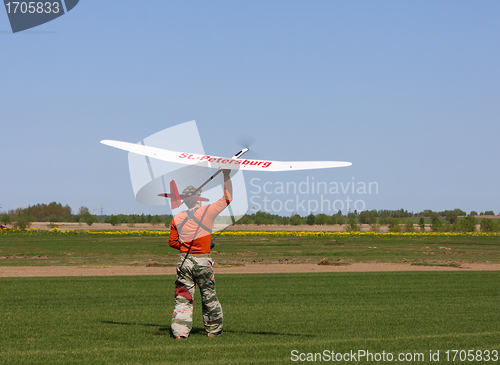 Image of Man launches into the sky RC glider