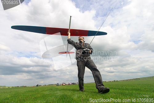 Image of Man launches into the sky RC glider