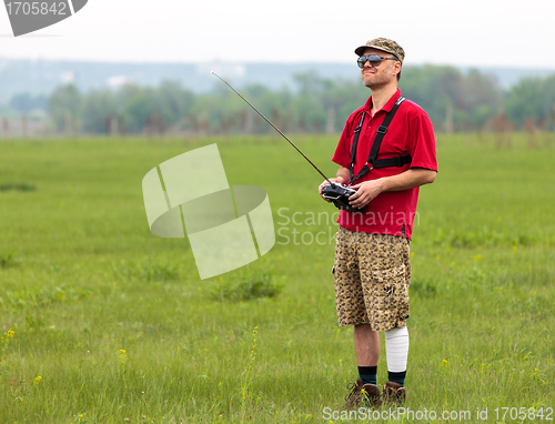 Image of Man controls RC glider